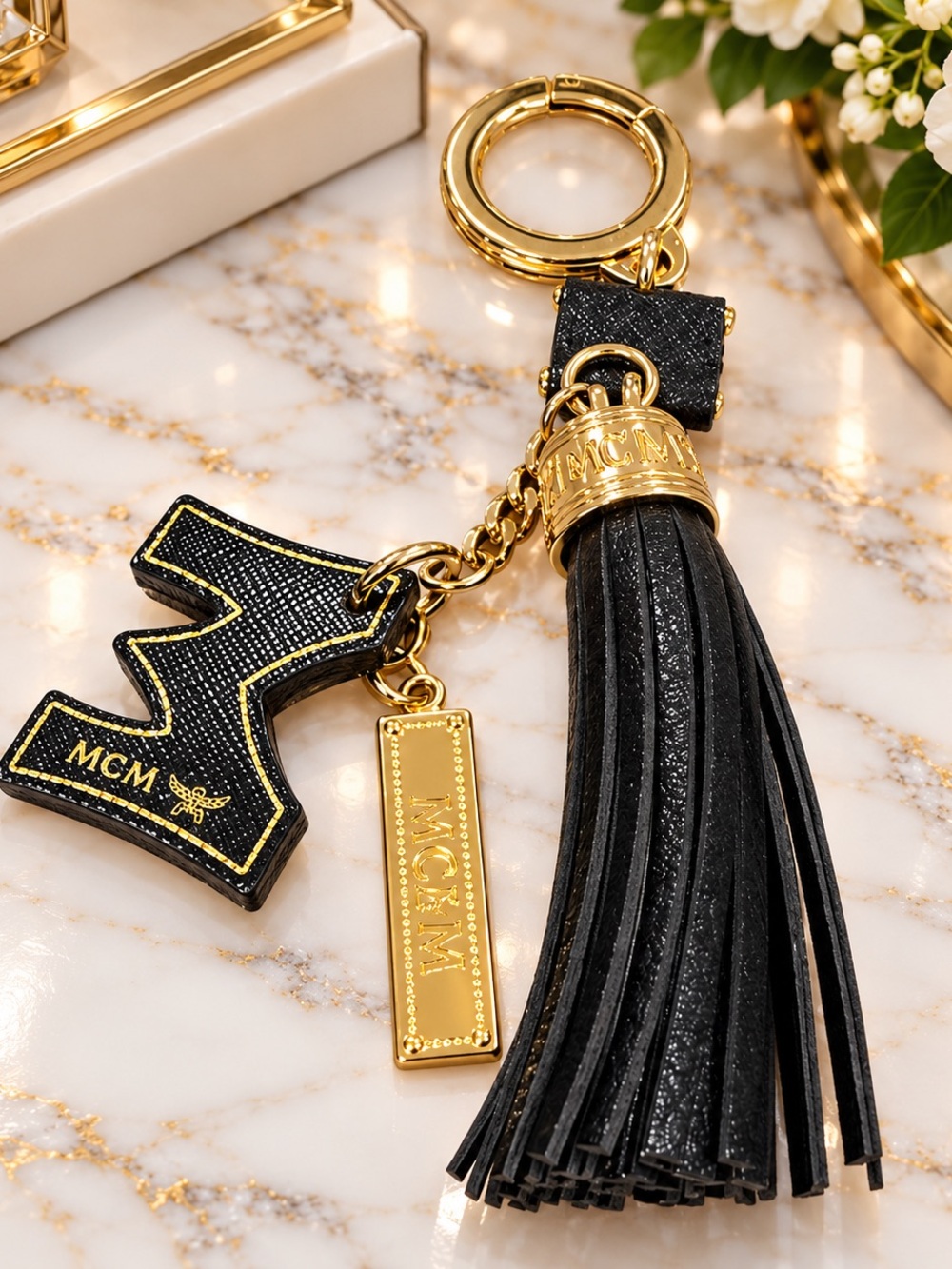 MCM Black Leather Tassel Keychain with Logo Charms